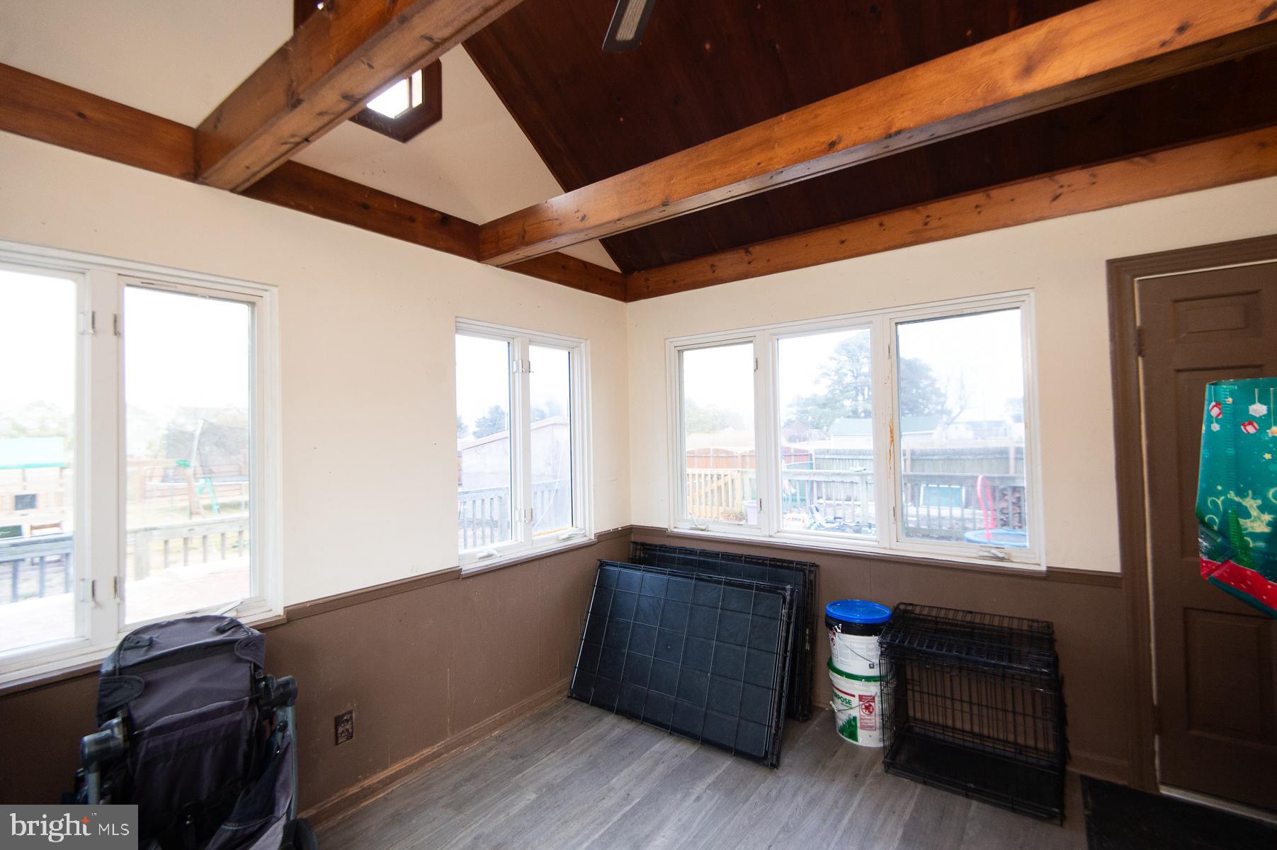 2537 Old House Point Road Fishing Creek, MD 21634 - Photo 10 of 37 a living room with furniture and large windows