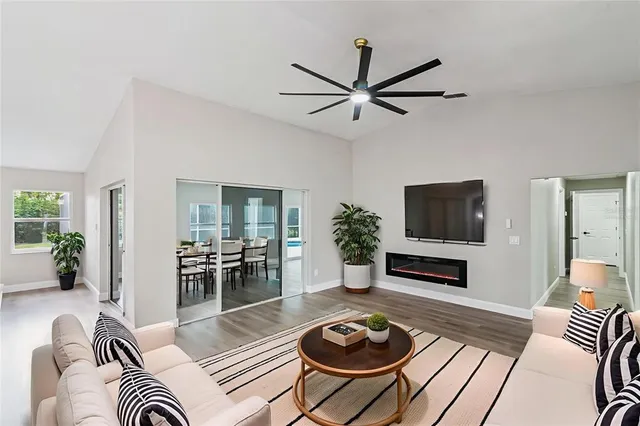 a view of an empty room and wooden floor