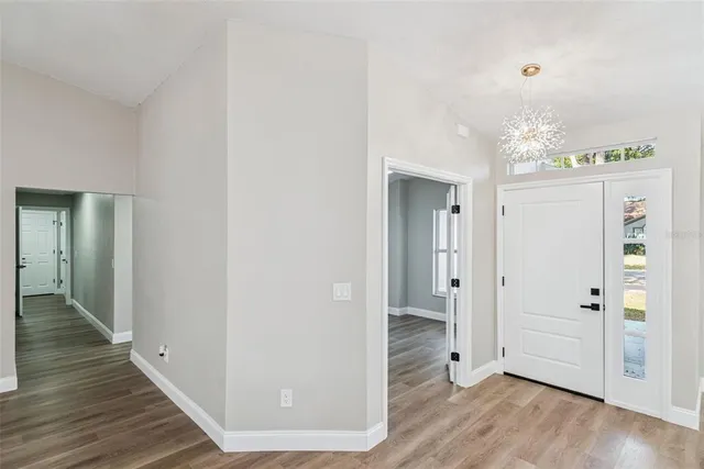 a front view of a house with a garden and yard