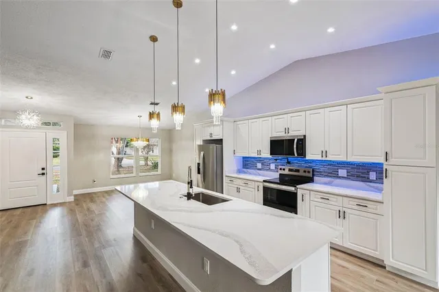 a view of a kitchen and a chandelier