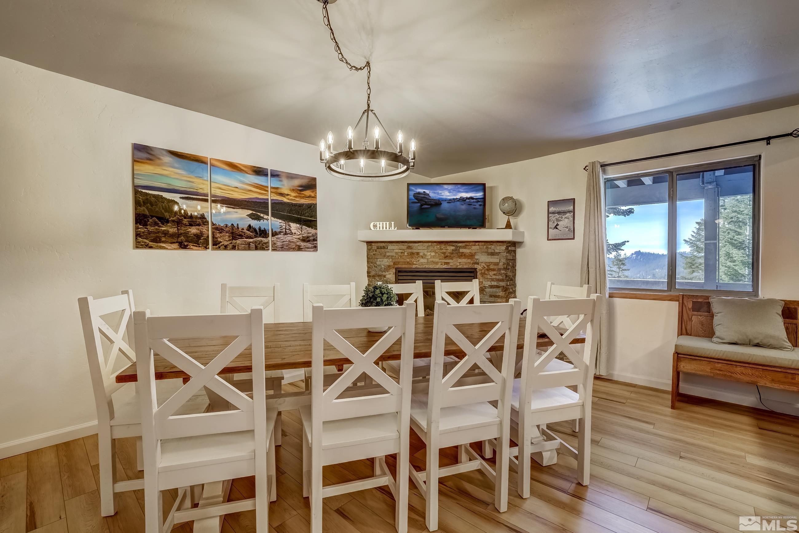 758 Milky Way Court, Unit B Stateline, NV 89449 - Photo 8 of 36 a view of a dining room with furniture wooden floor and chandelier