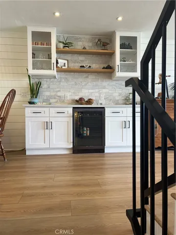 a kitchen with stainless steel appliances granite countertop a stove sink and cabinets