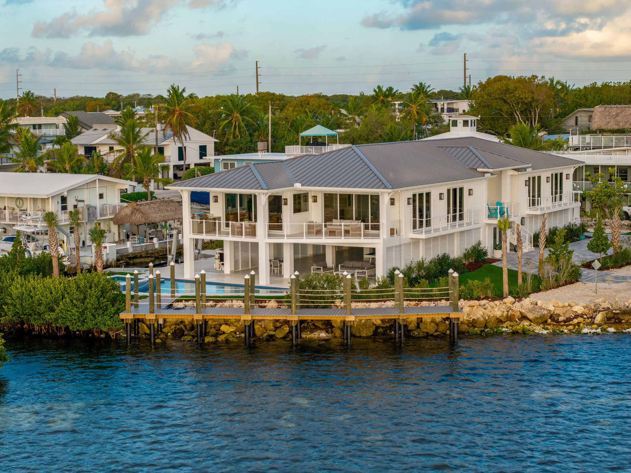 1002 Snapper Lane Key Largo, FL 33037 - Photo 90 of 106 a view of a lake with a building in the background