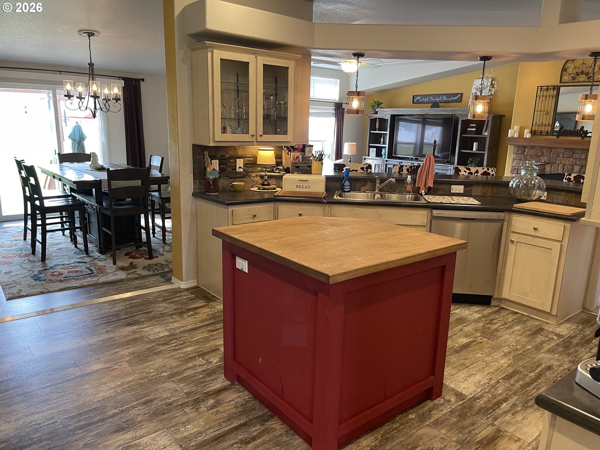 6404 Lookingglass Road Roseburg, OR 97471 - Photo 14 of 48 a room with wooden floors table and chairs