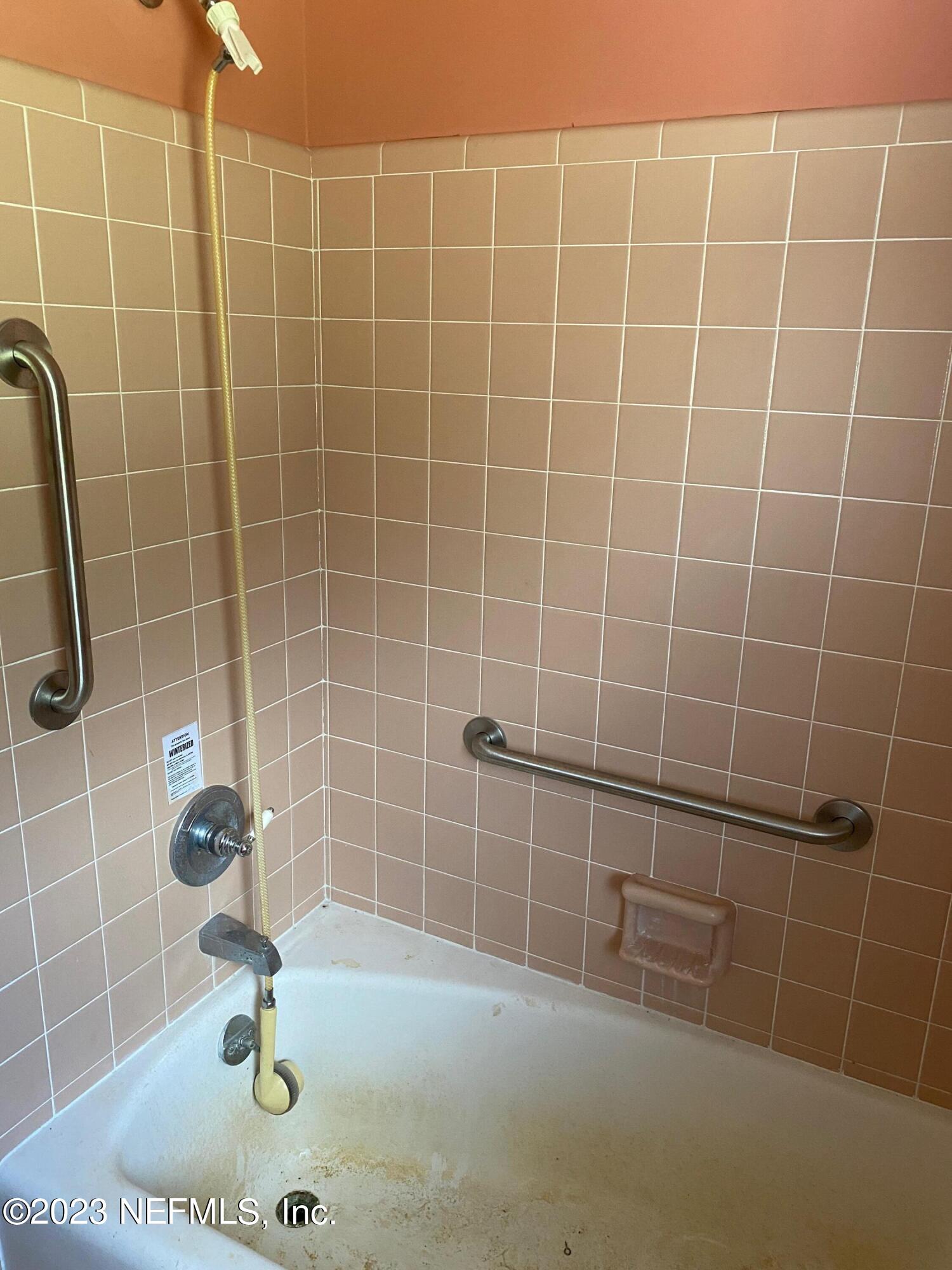 2827 Ribault Scenic Drive Jacksonville, FL 32208 - Photo 14 of 24 a bathroom with a shower