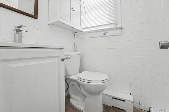 a living room with hard wood floors and a fireplace