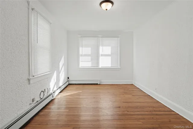 a living room with furniture a rug and a window