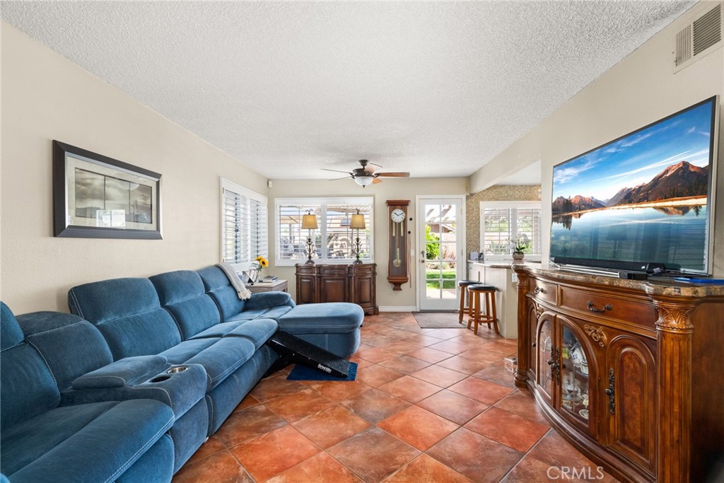 19422 Totem Court Riverside, CA 92508 - Photo 14 of 44 a living room with furniture and a flat screen tv
