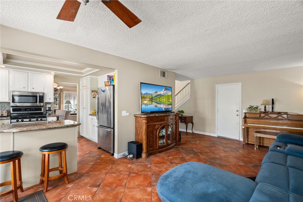 19422 Totem Court Riverside, CA 92508 - Photo 16 of 44 a living room with furniture and a flat screen tv