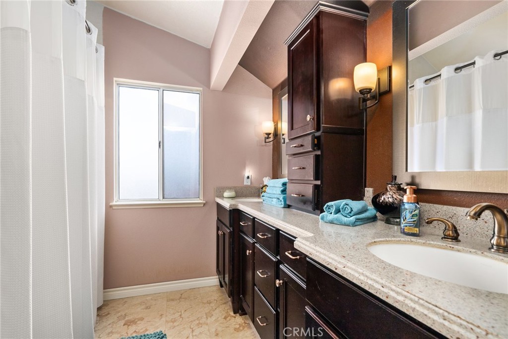 19422 Totem Court Riverside, CA 92508 - Photo 20 of 44 a bathroom with a granite countertop sink and a mirror