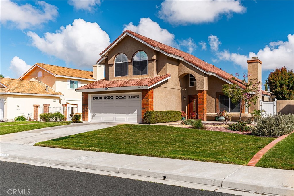 19422 Totem Court Riverside, CA 92508 - Photo 2 of 44 a front view of a house with a yard