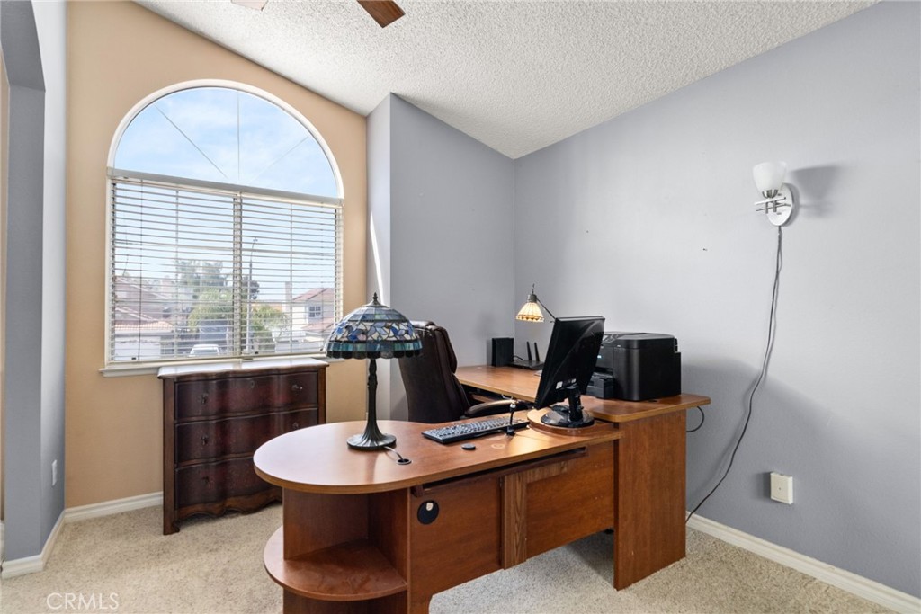 19422 Totem Court Riverside, CA 92508 - Photo 21 of 44 a view of a workspace with furniture and a window
