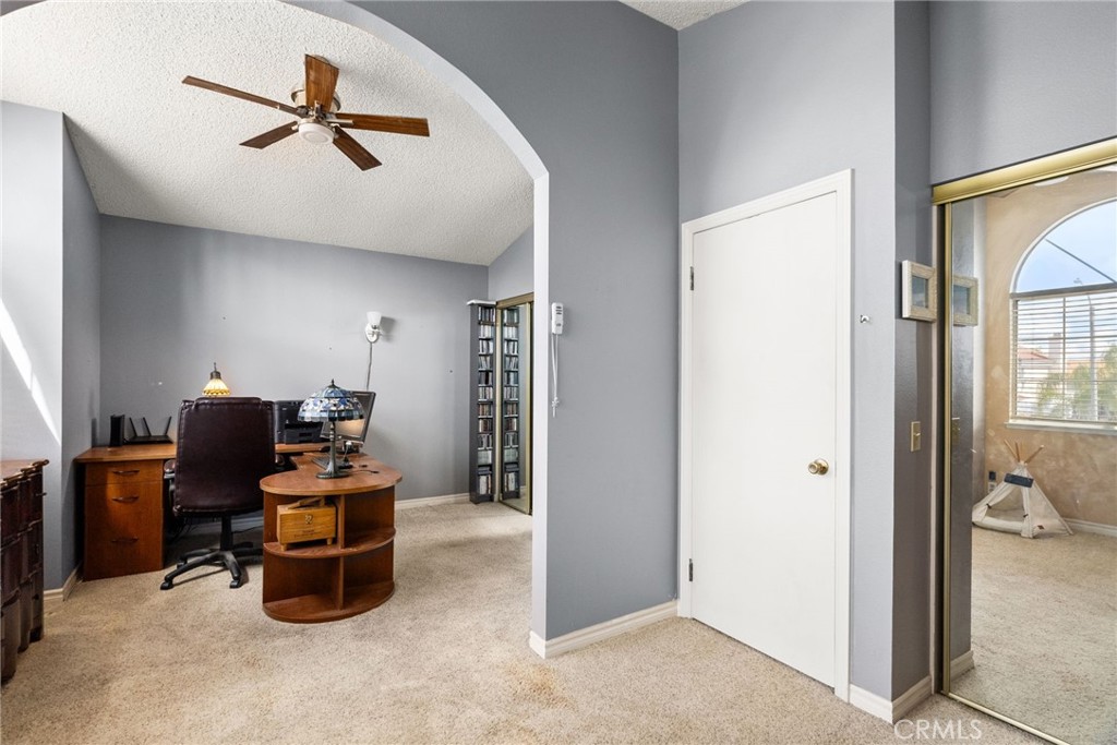 19422 Totem Court Riverside, CA 92508 - Photo 25 of 44 a living room with furniture a ceiling fan and a window