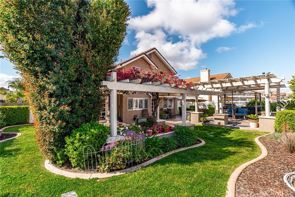 19422 Totem Court Riverside, CA 92508 - Photo 28 of 44 a view of a house with swimming pool and garden