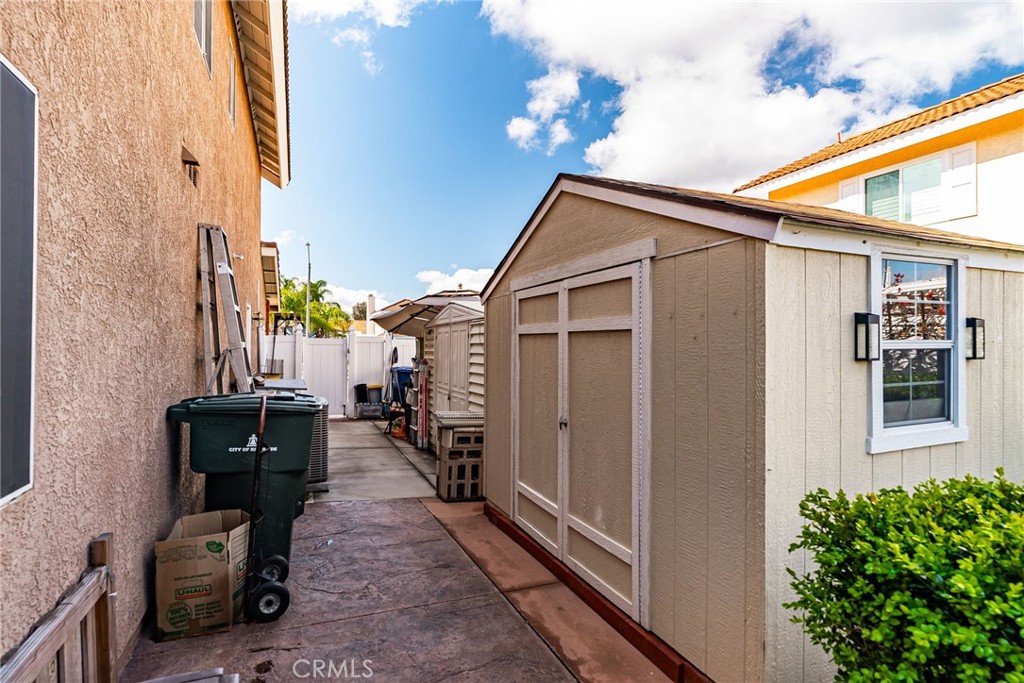 19422 Totem Court Riverside, CA 92508 - Photo 36 of 44 a backyard of a house with glass top table and chairs