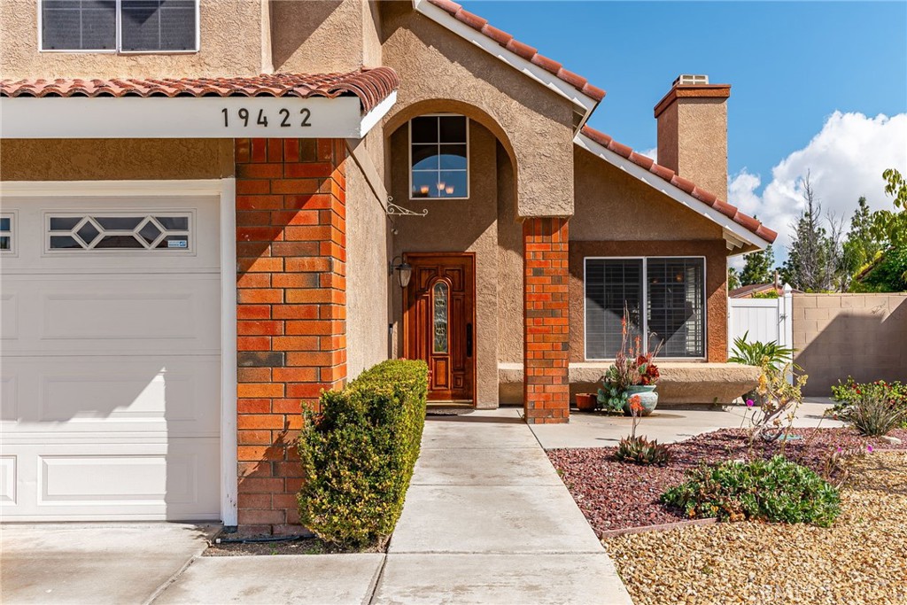 19422 Totem Court Riverside, CA 92508 - Photo 4 of 44 a front view of a building with garden