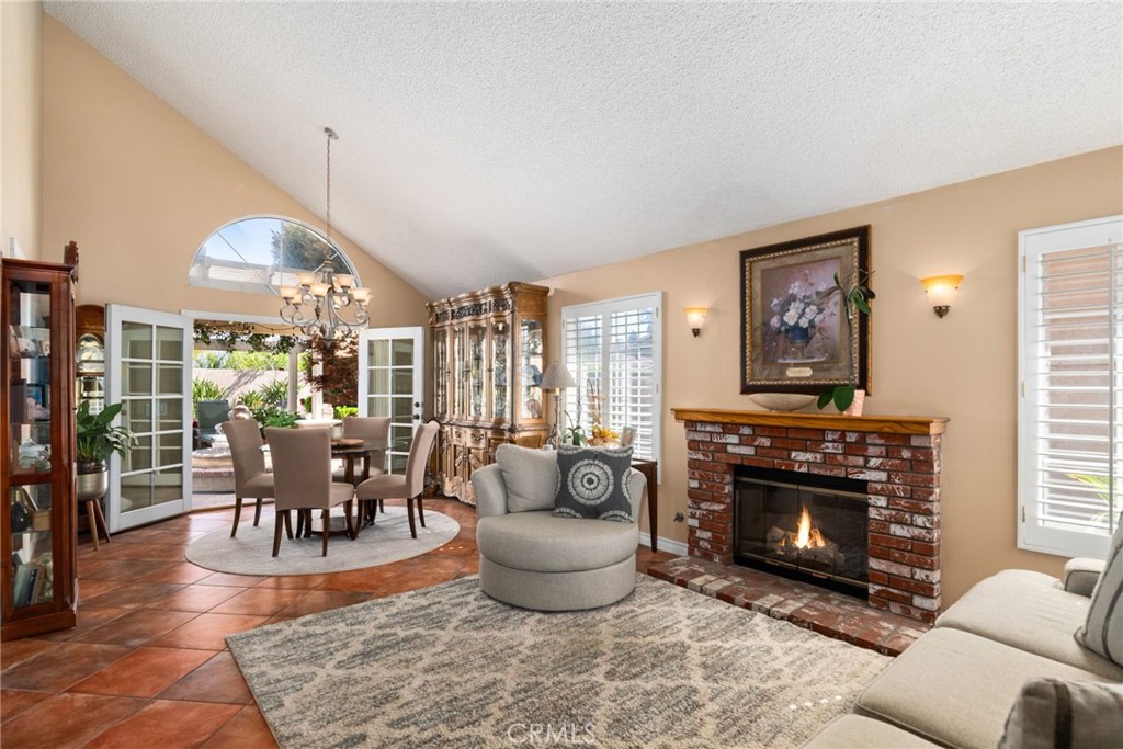 19422 Totem Court Riverside, CA 92508 - Photo 5 of 44 a living room with furniture a large window and a fireplace