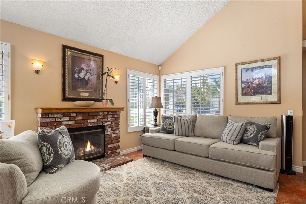 19422 Totem Court Riverside, CA 92508 - Photo 7 of 44 a living room with furniture a large window and a fireplace