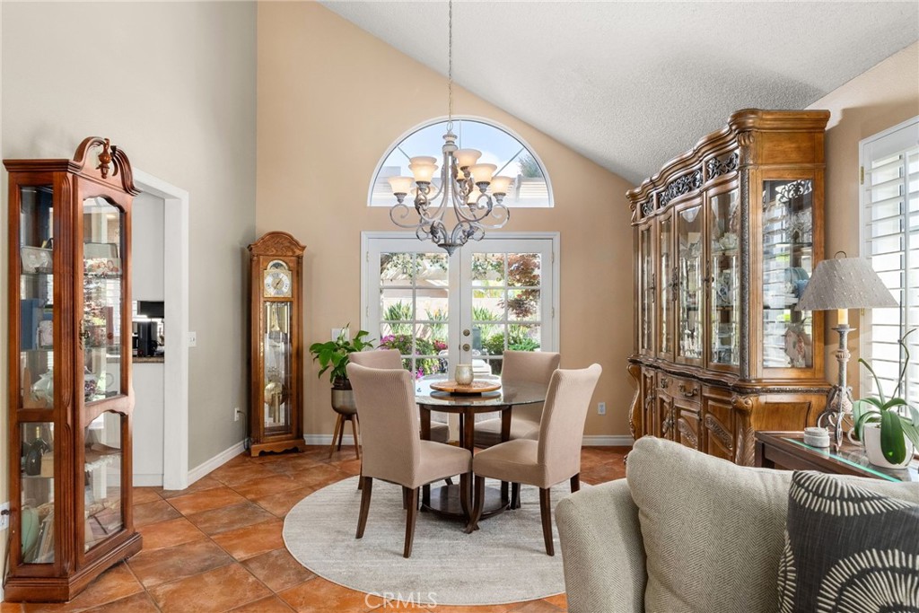 19422 Totem Court Riverside, CA 92508 - Photo 8 of 44 a dining room with furniture a chandelier and a rug