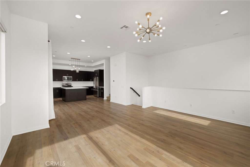 370 Broadway Drive Brea, CA 92821 - Photo 11 of 32 a view of kitchen and hall with wooden floor