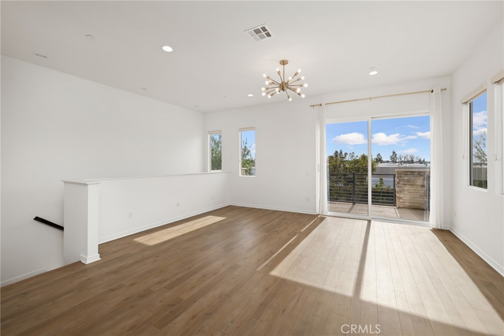 370 Broadway Drive Brea, CA 92821 - Photo 13 of 32 wooden floor in an empty room with a window