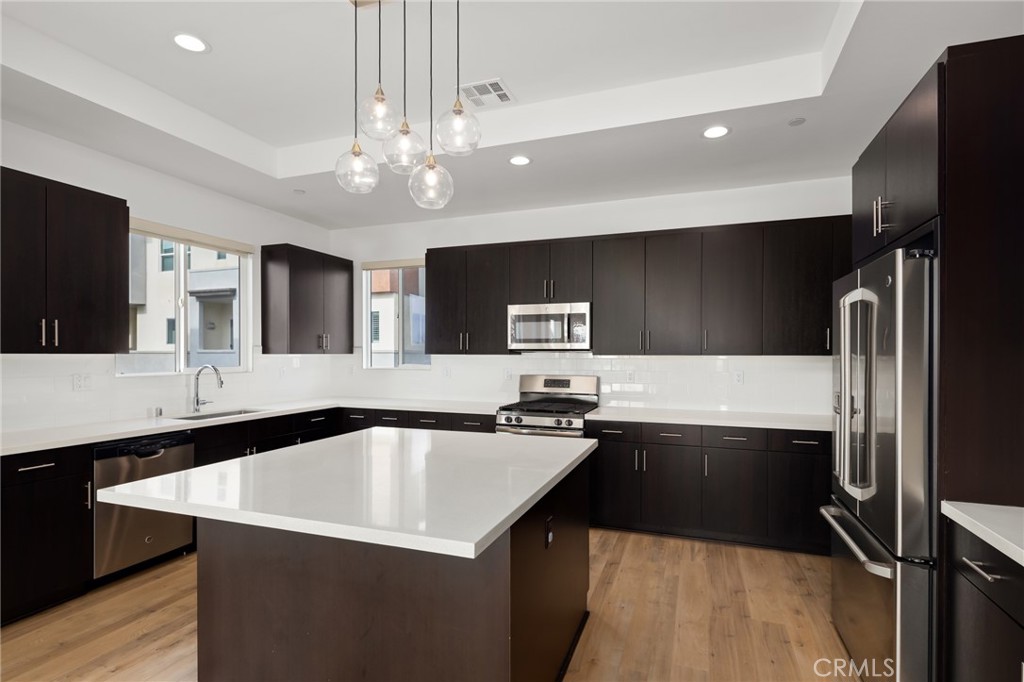 370 Broadway Drive Brea, CA 92821 - Photo 17 of 32 a kitchen with a sink stainless steel appliances and cabinets