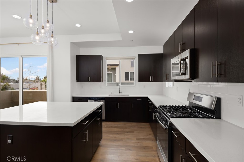 370 Broadway Drive Brea, CA 92821 - Photo 18 of 32 a kitchen with a sink and a stove top oven