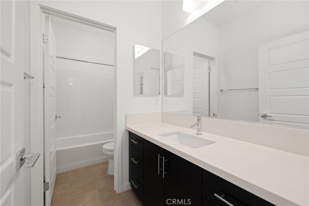 370 Broadway Drive Brea, CA 92821 - Photo 24 of 32 a bathroom with a sink a tub and a mirror