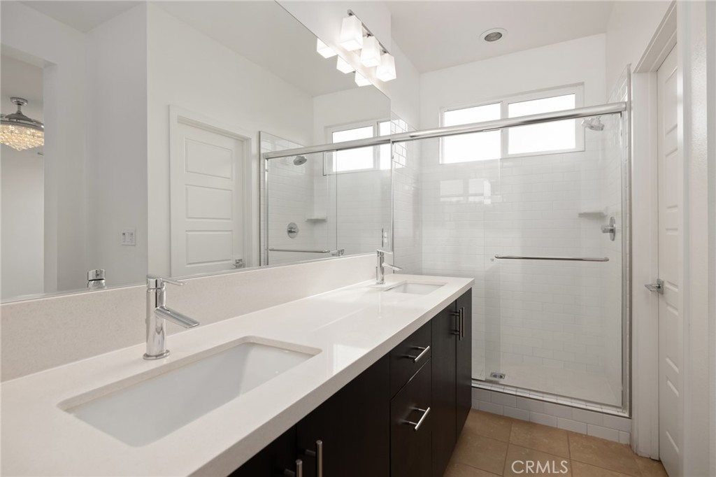 370 Broadway Drive Brea, CA 92821 - Photo 28 of 32 a bathroom with a sink double vanity and a shower