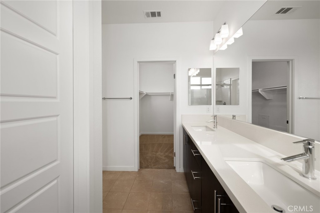 370 Broadway Drive Brea, CA 92821 - Photo 29 of 32 a bathroom with a sink double vanity and a mirror