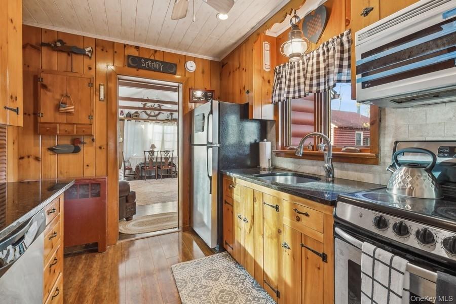 1850 Sterling Road Cutchogue, NY 11935 - Photo 18 of 28 a kitchen with granite countertop a refrigerator and a sink