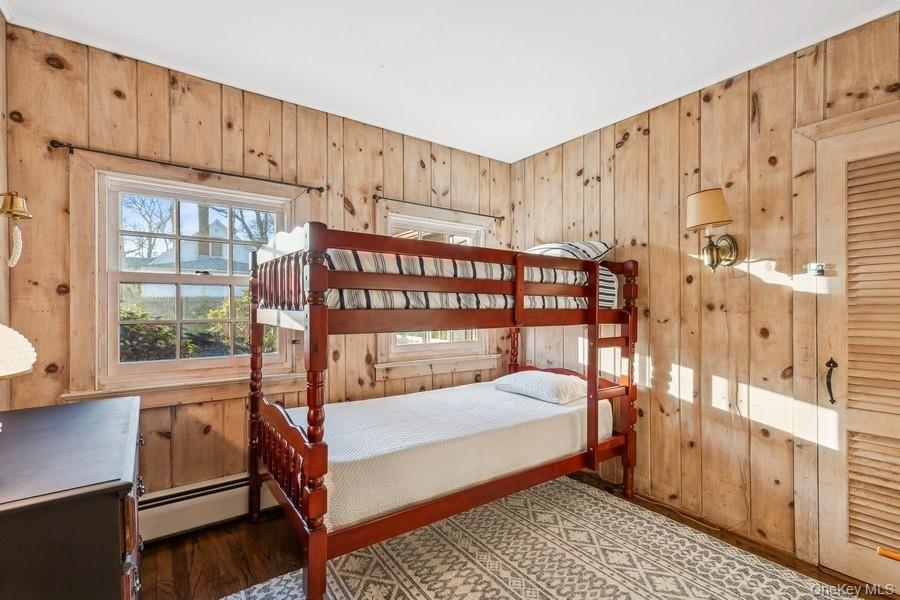 1850 Sterling Road Cutchogue, NY 11935 - Photo 23 of 28 a bedroom with furniture and a window