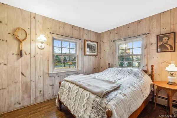 a spacious bedroom with a bed and a window