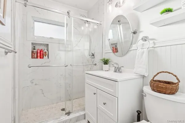 a bathroom with a sink a vanity and a mirror