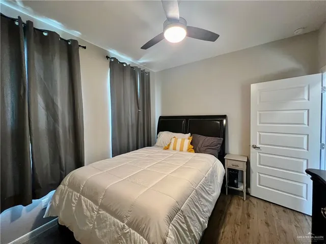 a bedroom with a bed and a dresser