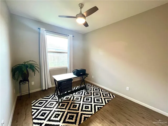 a view of workspace with wooden floor