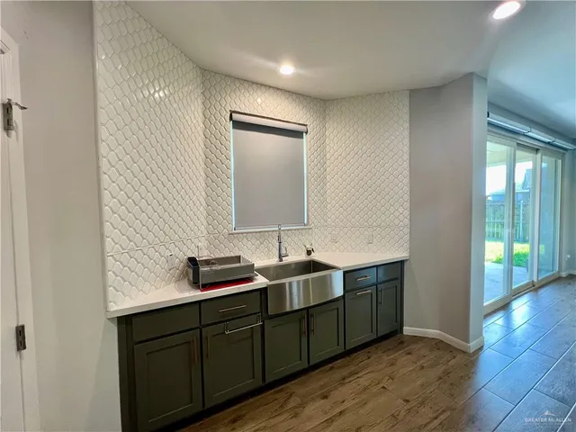 a bathroom with a double vanity sink and mirror