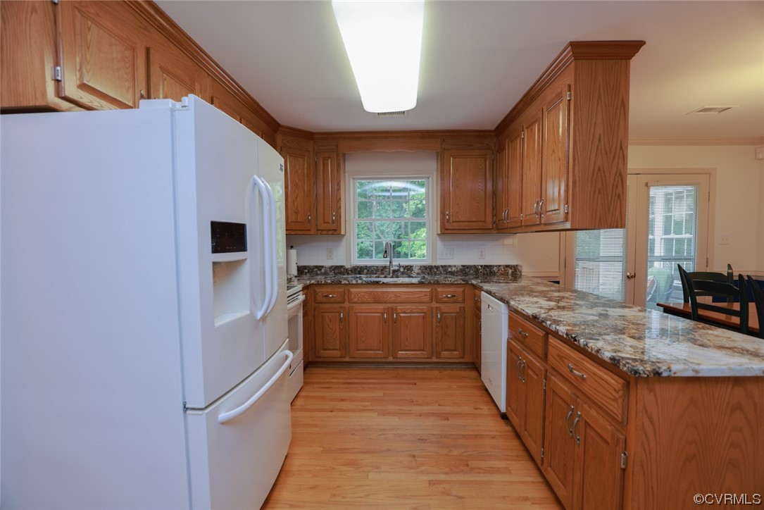 12610 Lilking Road Chester, VA 23831 - Photo 15 of 50 a kitchen with stainless steel appliances granite countertop a refrigerator a sink dishwasher a stove with wooden cabinets and floor