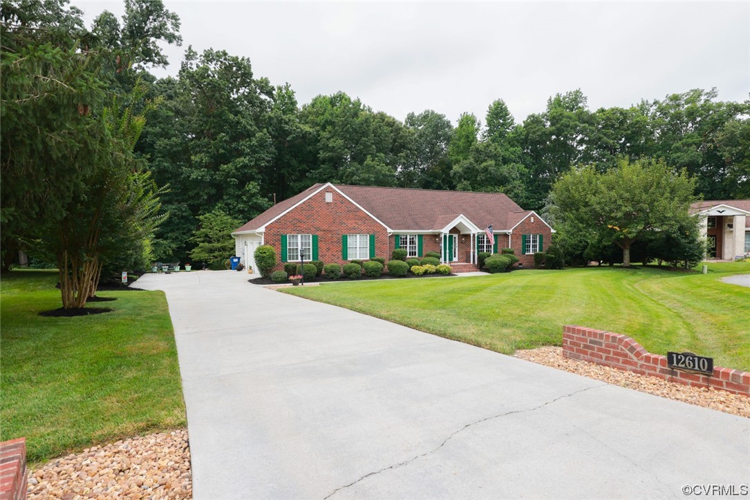 12610 Lilking Road Chester, VA 23831 - Photo 2 of 50 a house with garden in front of it