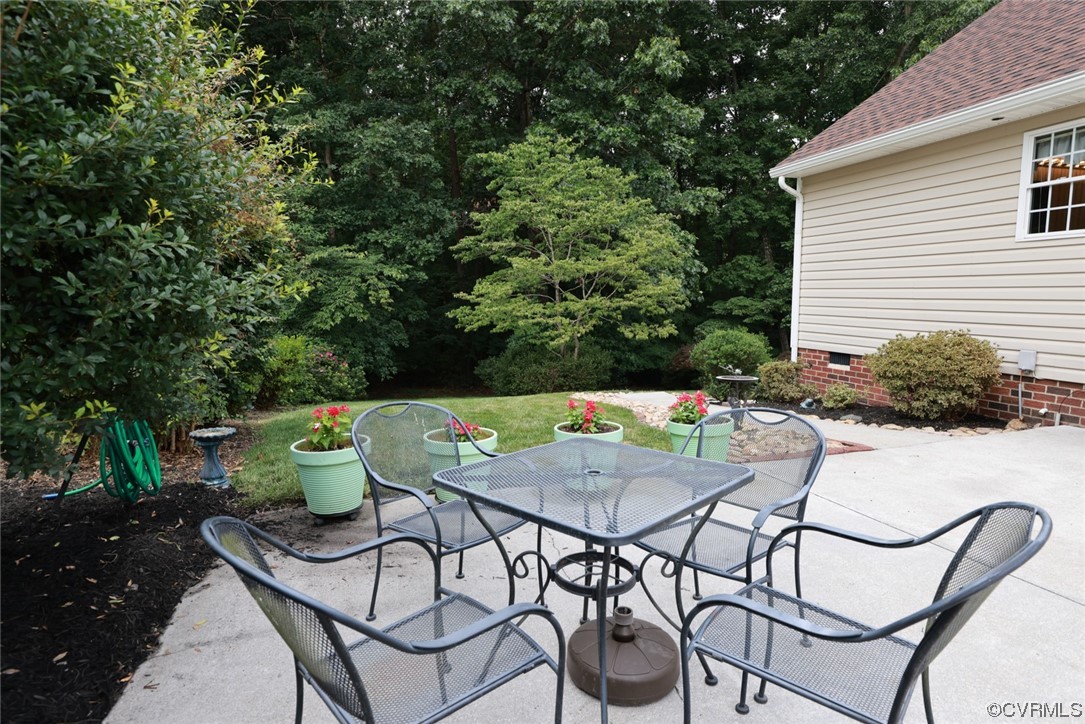 12610 Lilking Road Chester, VA 23831 - Photo 43 of 50 a view of a chairs and table in patio