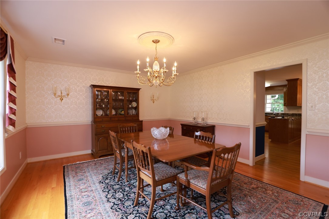 12610 Lilking Road Chester, VA 23831 - Photo 8 of 50 a view of a dining room with furniture and chandelier