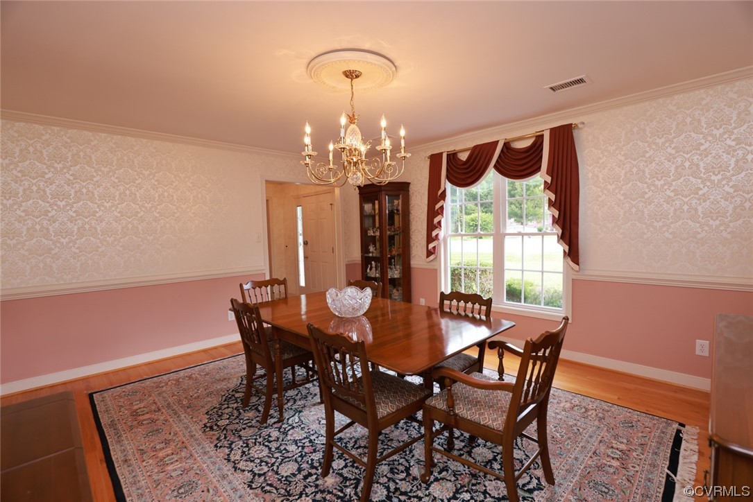 12610 Lilking Road Chester, VA 23831 - Photo 9 of 50 a view of a dining room with furniture and chandelier
