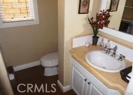 a kitchen with stainless steel appliances granite countertop a kitchen island a stove a refrigerator and a counter top space