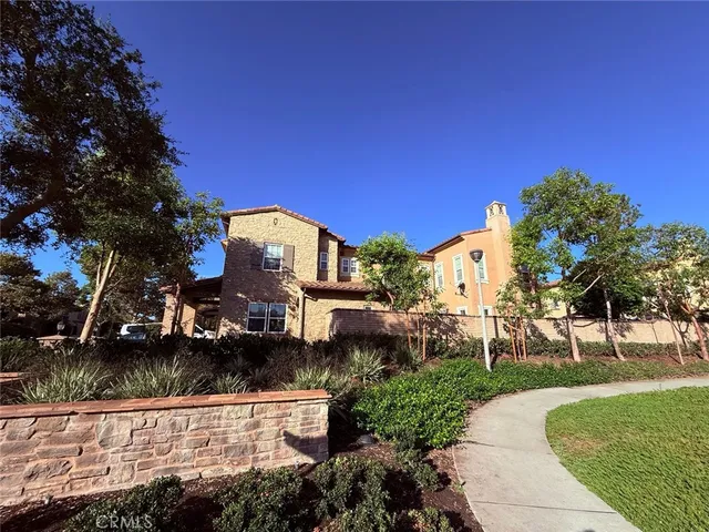 a kitchen with kitchen island granite countertop a sink a counter top space and cabinets