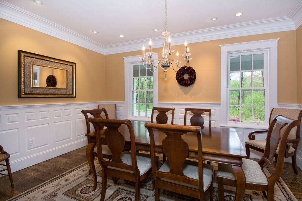 158 First Parish Road Scituate, MA 02066 - Photo 12 of 27 a view of a dining room with furniture and chandelier