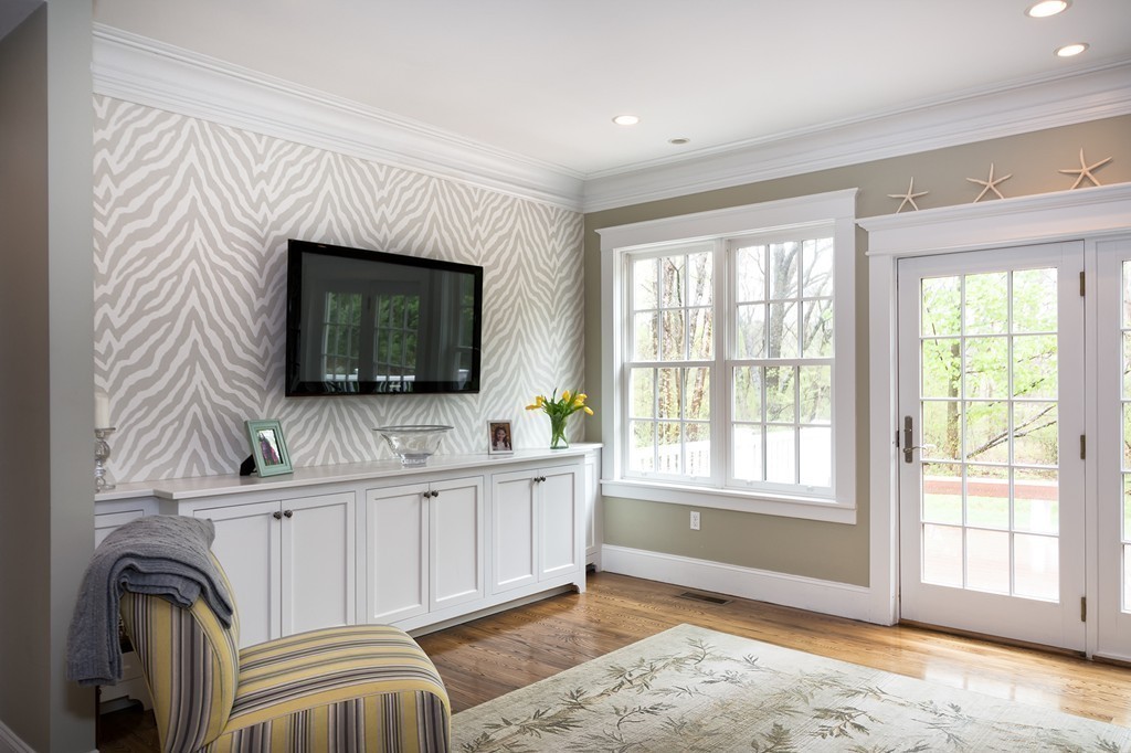 158 First Parish Road Scituate, MA 02066 - Photo 15 of 27 a living room with furniture a flat screen tv and a fireplace