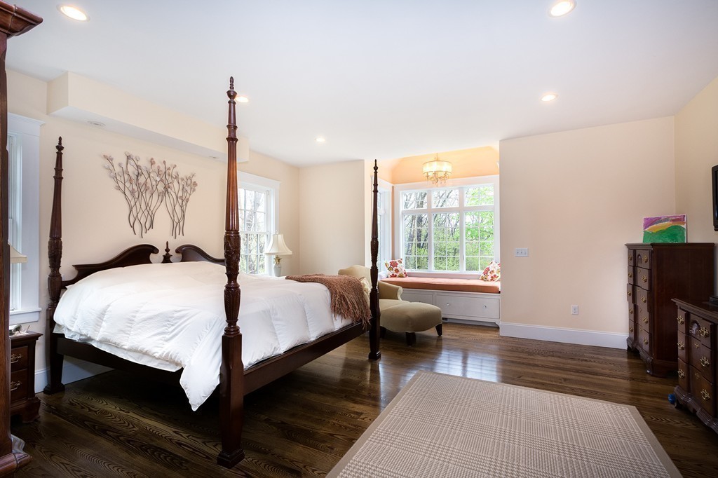 158 First Parish Road Scituate, MA 02066 - Photo 18 of 27 a bedroom with a bed wooden floor and a window