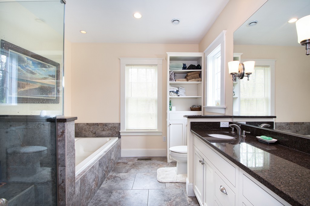 158 First Parish Road Scituate, MA 02066 - Photo 20 of 27 a bathroom with a granite countertop sink and a bathtub
