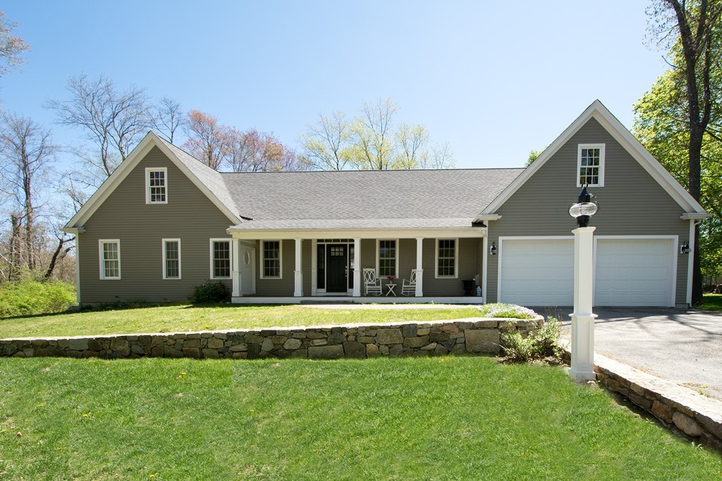 158 First Parish Road Scituate, MA 02066 - Photo 2 of 27 a front view of a house with a garden