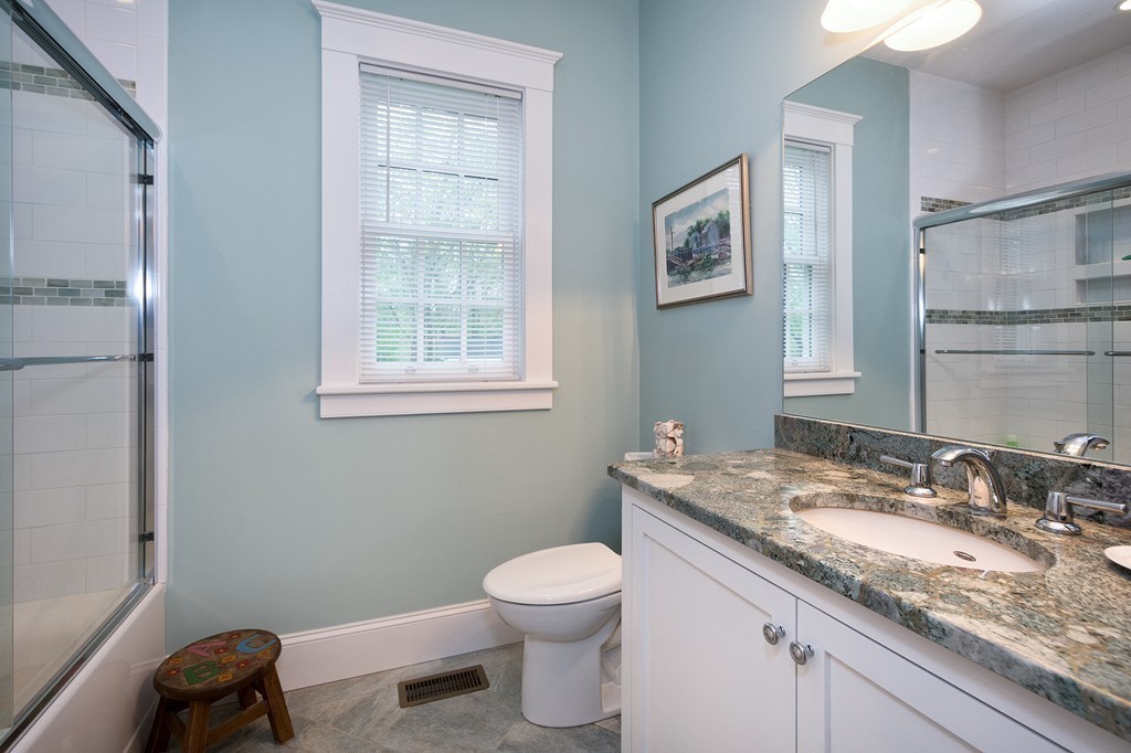 158 First Parish Road Scituate, MA 02066 - Photo 22 of 27 a bathroom with a granite countertop sink a toilet and a mirror
